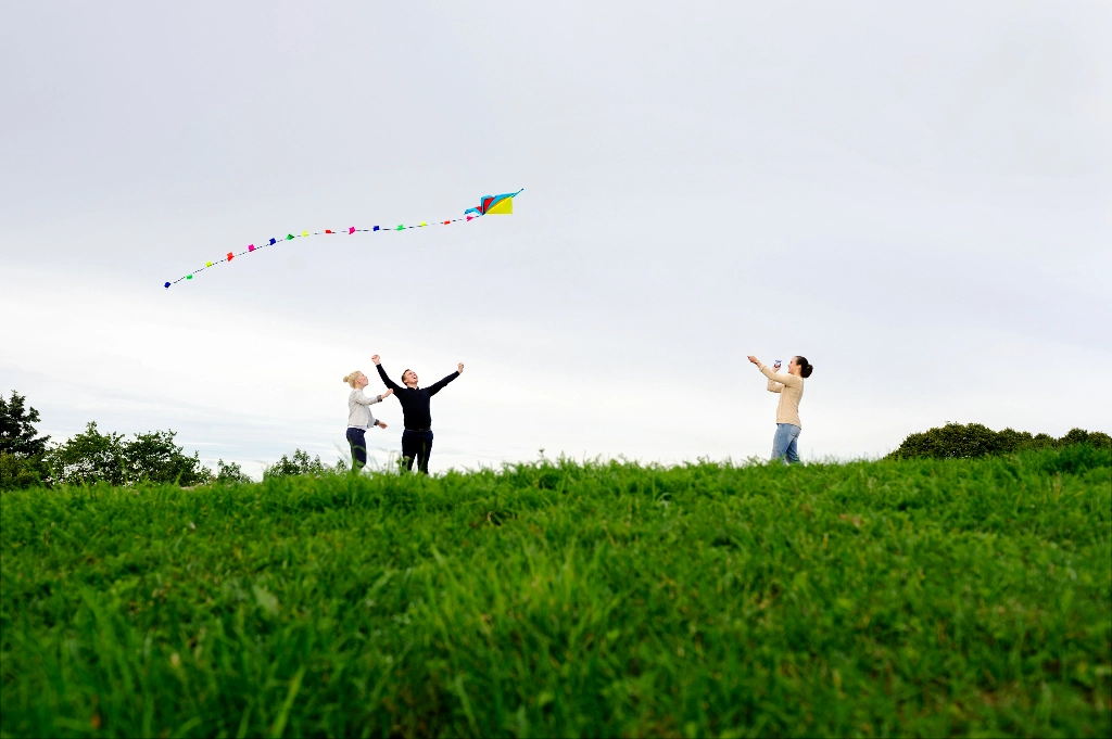A group of people are flying kite