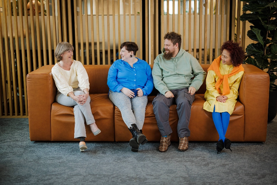Four people sitting on the couch  - Markus Pentikäinen / Keksi