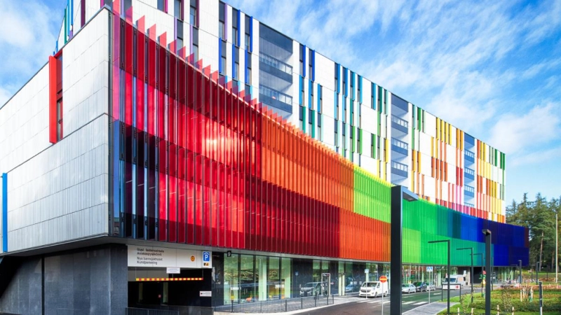 A colourful facade of a hospital building. - HUS