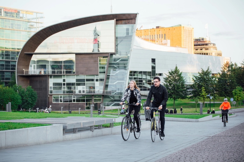 A couple rides bikes in Finland's capital, Helsinki.  - Julia Kivelä / Visit Finland