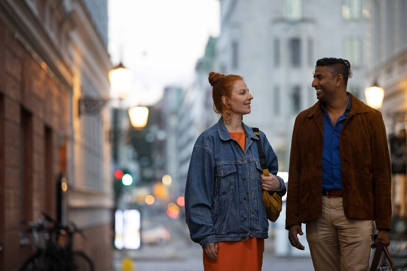 Woman and man on a street talking